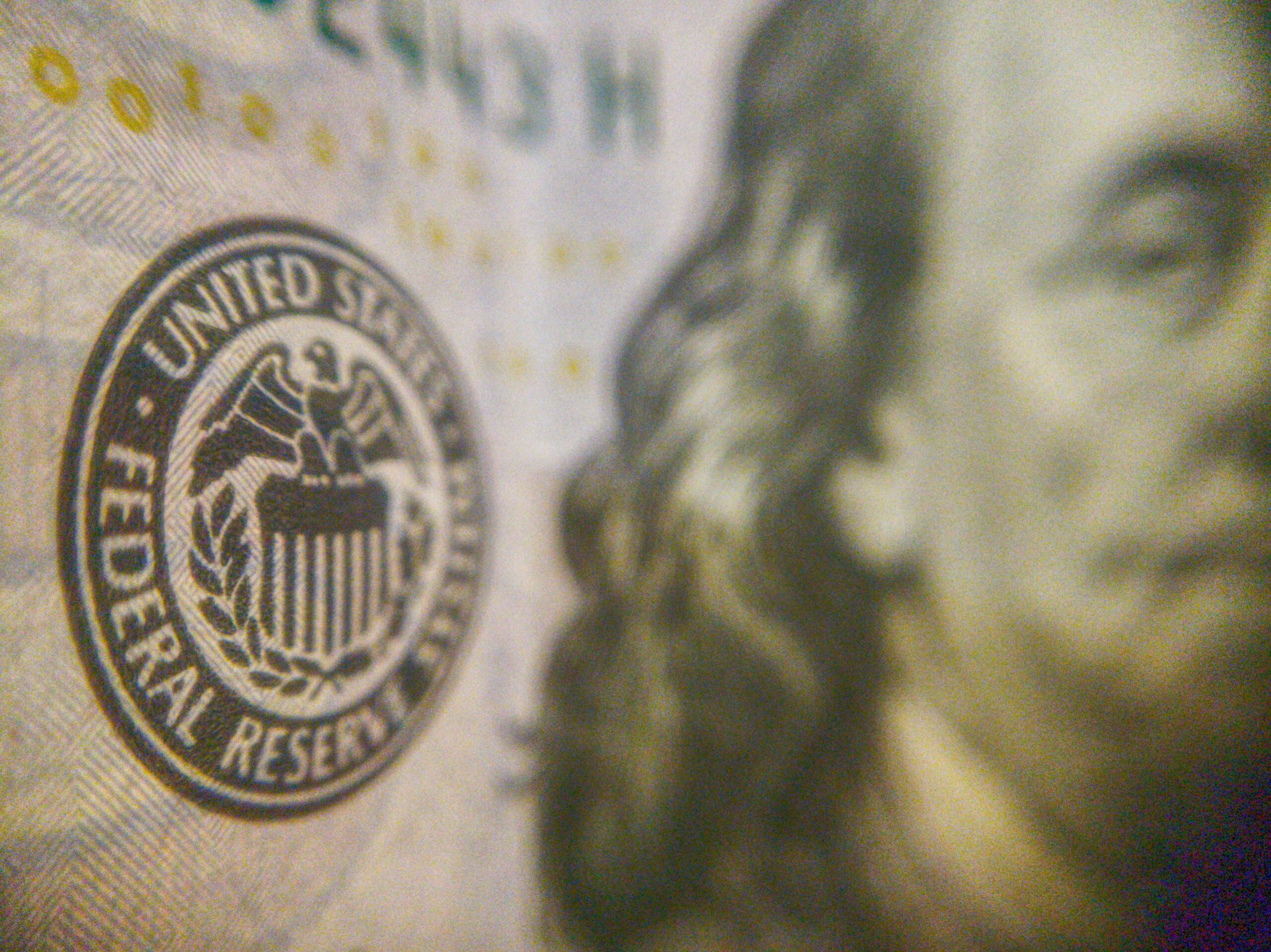 Federal Reserve logo on a dollar bill