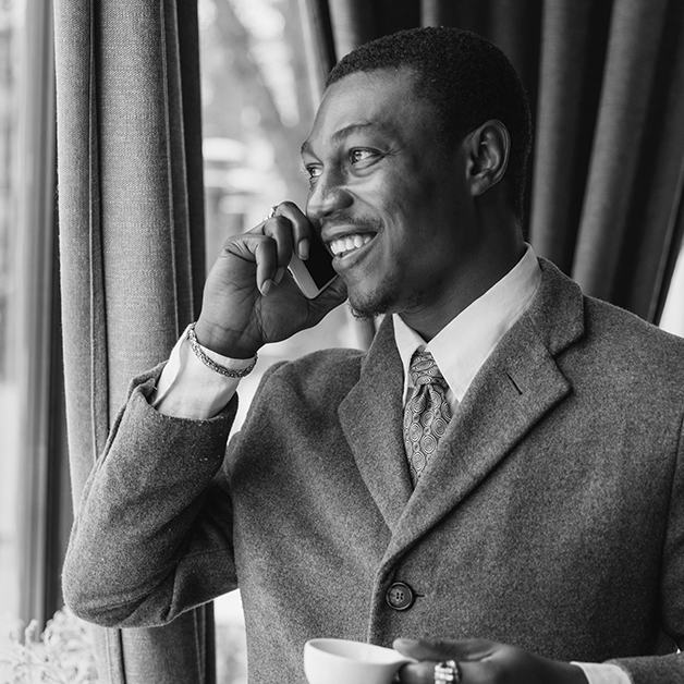 Executive on phone discussing executive compensation and benefits package
