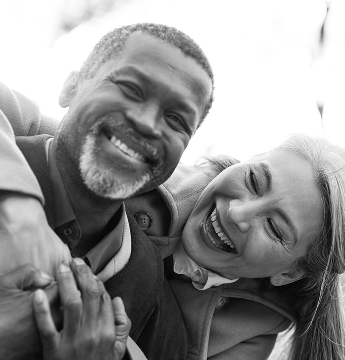 Candid of happy retired couple grateful they completed retirement income planning for the confidence it provided in retirement