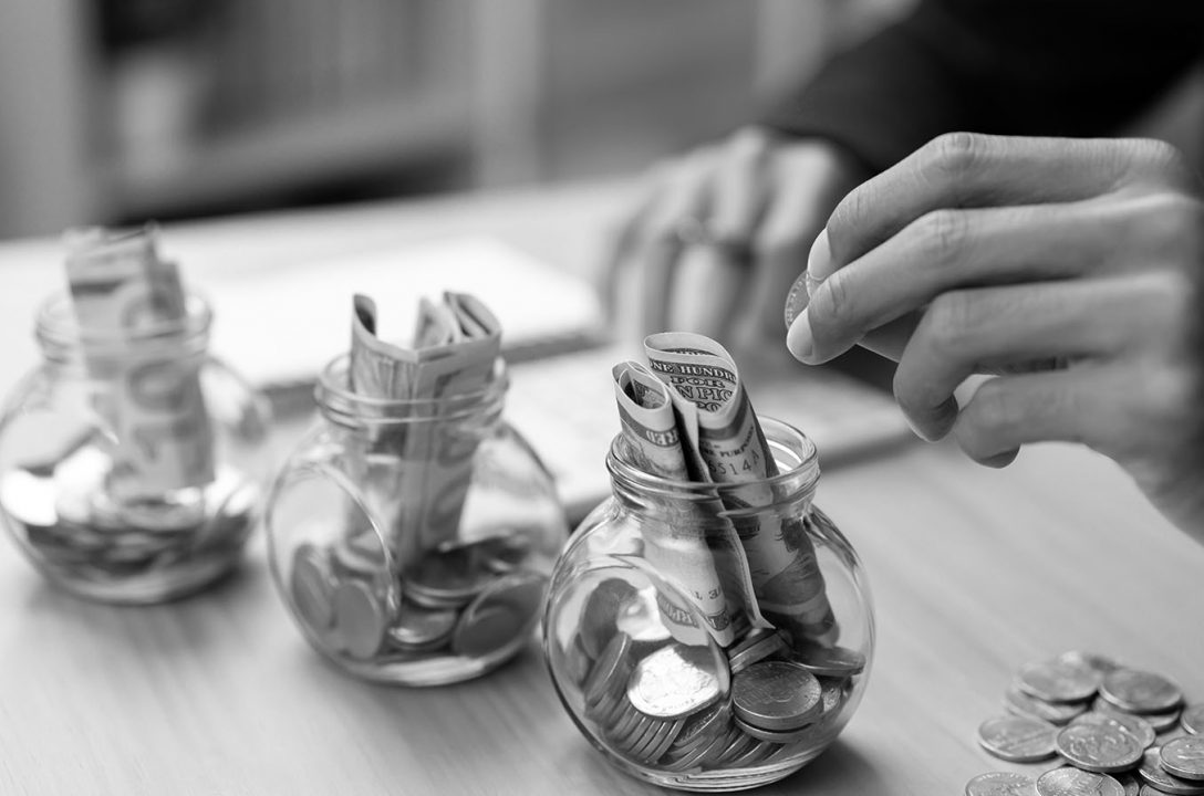 Multiple jars of money representing nonprofit reserve segmentation