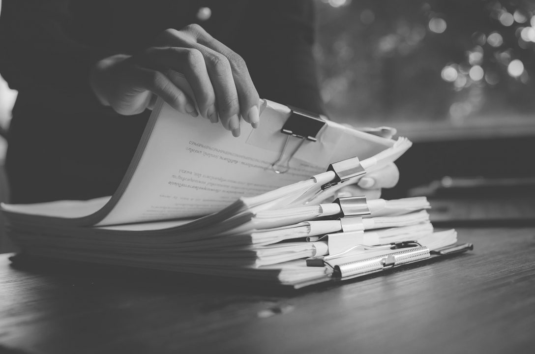 Stack of proposals representing the RFP process for Nonprofits and Associations