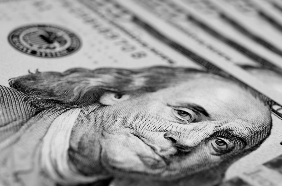 100 dollar bills representing when cash become an investment portfolio